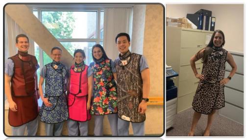 people posing in colorful aprons